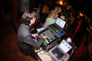 Wedding DJ at a wedding reception with DJ equipment